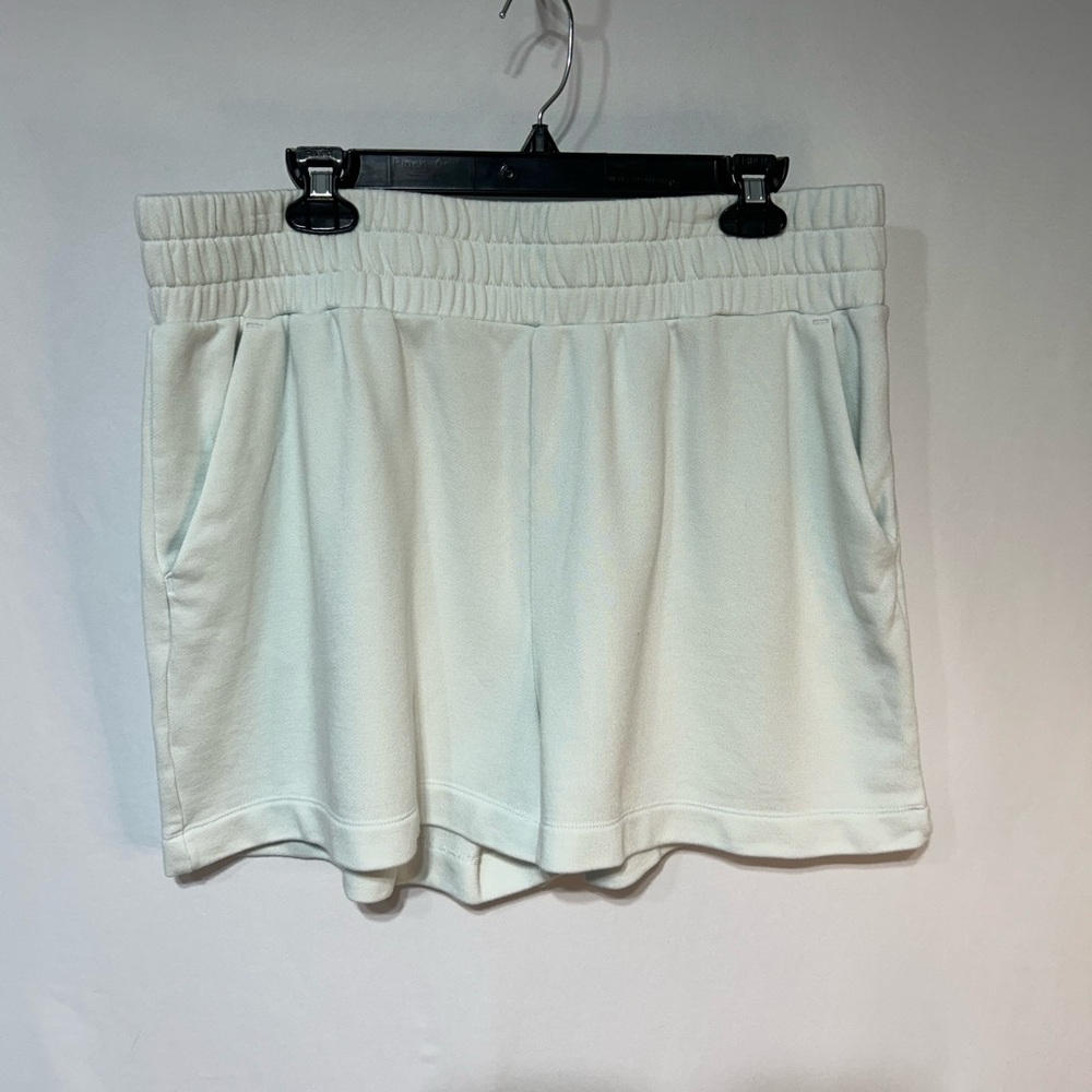 Mint green Athletic Shorts with Elastic Waistband and Lightweight Fabric.